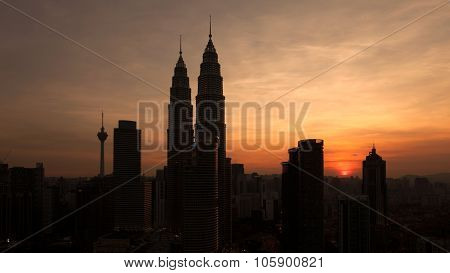 Silhouette of Kuala Lumpur skyline during sunset
