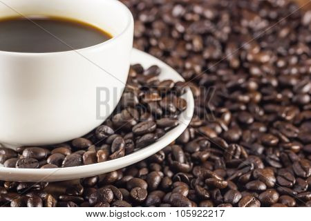 A Cup Of Coffee And Coffee Beans Background Warm Toning, Selective Focus