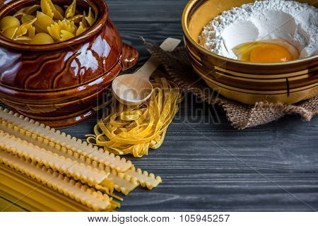 Pasta Mix With Ingredients On Wooden Background