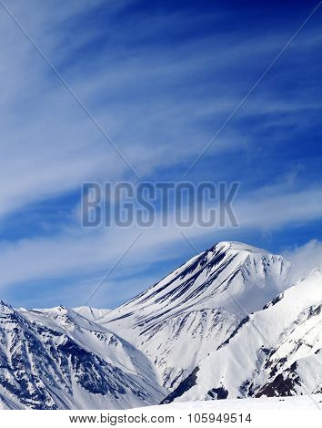 Winter Snowy Mountains In Sun Windy Day