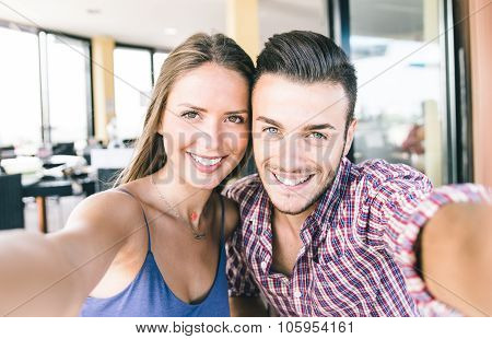 Couple Taking Self Portrait With Smart Phone