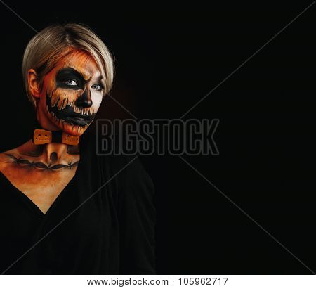 Halloween Portrait Of Body Art Pumpkin Girl With Pumpkin Bowtie On Black Background. Real Greasepain