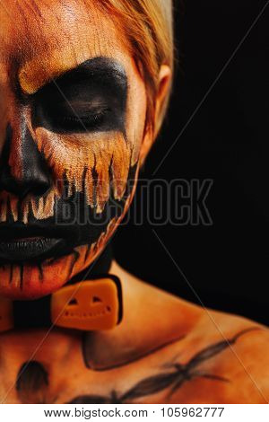 Halloween Portrait Of Body Art Pumpkin Close Eyes Girl With Pumpkin Bowtie On Black Background. Real