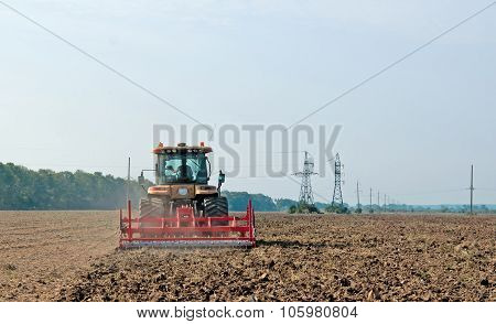 Tractor Processes Field