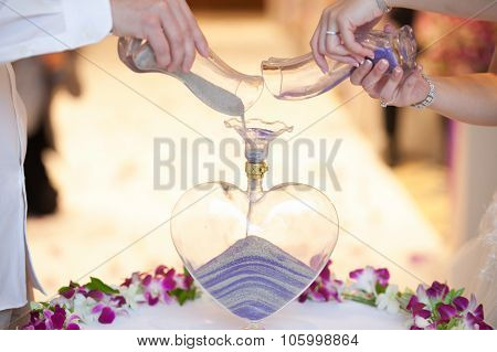 Blending Of The Sands At Wedding Ceremony