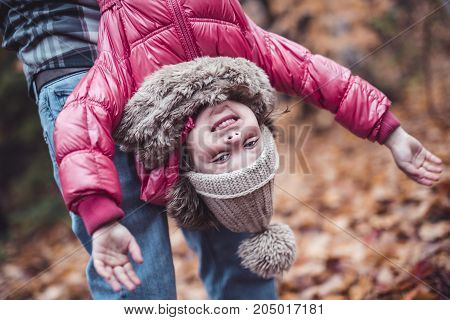 A kid girl in autumne season wearing a hat