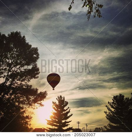 a hot air balloon silhouette at sunset.