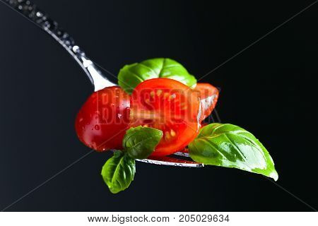 Tomato Cherry Slices And Green Basil