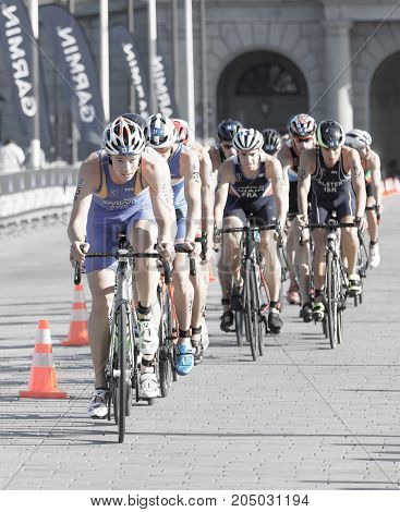 STOCKHOLM - AUG 26 2017: Many triathlete cyclists in a group Gabriel Sandor in the lead in the Men's ITU World Triathlon series event August 26 2017 in Stockholm Sweden