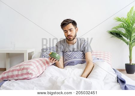 A man is overslept, he missed the alarm