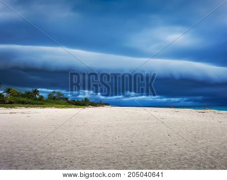 clouds, clouds on the ocean and a stretch of beach in front of the hurricane, Cuba