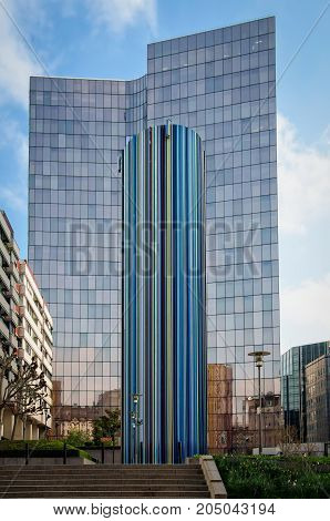 Paris France - April 20 2013: Thirty-meter high Le Moretti monument in La Defense district. It is used to ventilate the workings beneath the esplanade.