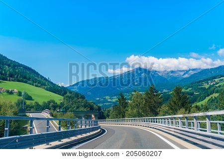 country road at the european alps mountains