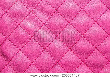 Pink quilted leather. Stylish background pattern. bright color.