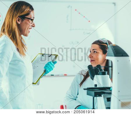 Scientists Working In Their Lab, Toned Image, Two Women