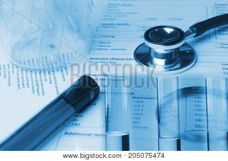 double exposure of stethoscope test tube beaker and medical information form on desk medical research diagnosis blood test medical report record and history patient concept blue color tone