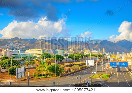 road outcome on the island of Tenerife in the distance in the country a beautiful mountain ridge pleasant evening light