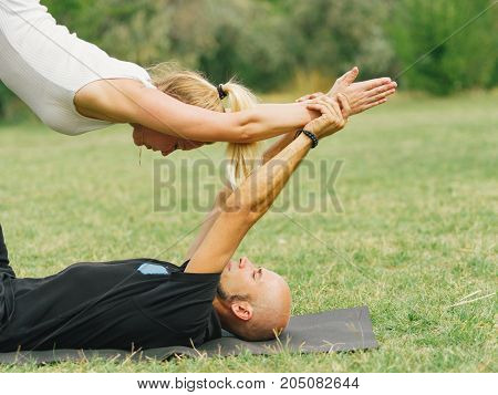 Sportt life and health concept. Yoga time on summer day.