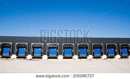 Row of loading docks with shutter doors at a warehouse
