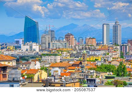 panorama of the city of Milan from a building roof in are far in the country the mountain ridge is seen