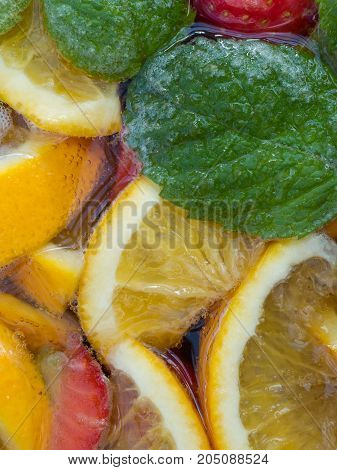 Closeup of Punch Cocktail with Fruit and Mint Leaves