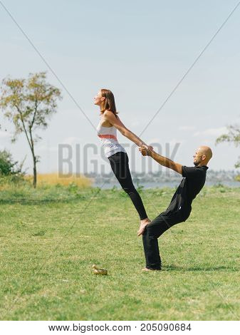 Sportt life and health concept. Yoga time on summer day.