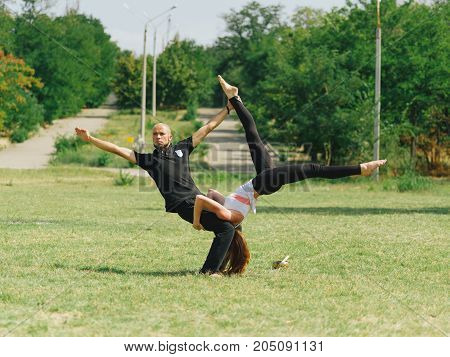Sportt life and health concept. Yoga time on summer day.