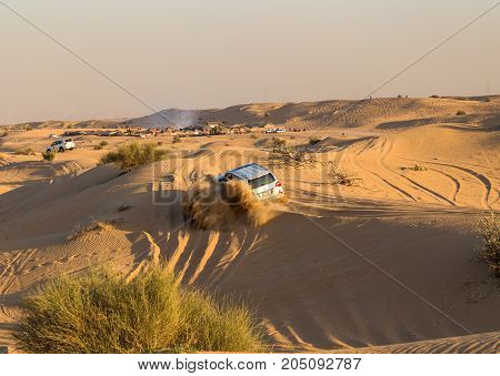 DUBAI UNITED ARAB EMIRATES - JANUARY 25 2016: Safari rally off-road car 4x4 adventure driving in the desert sand dune is a popular activity among tourists in Dubai.