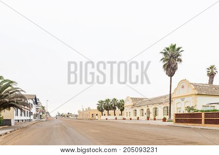 SWAKOPMUND NAMIBIA - JUNE 30 2017: A street scene with the Hotel Prinzessin Rupprecht and the Kaserne building in Swakopmund in the Namib Desert on the Atlantic Coast of Namibia