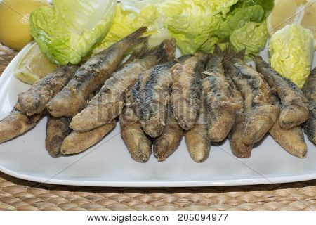 Boquerones fried, fried anchovies typical in Spain