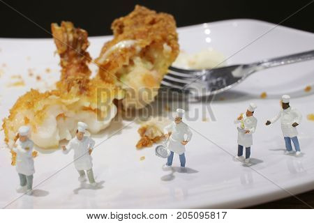 Tiny Of Cook Are Talking In The Kitchen.