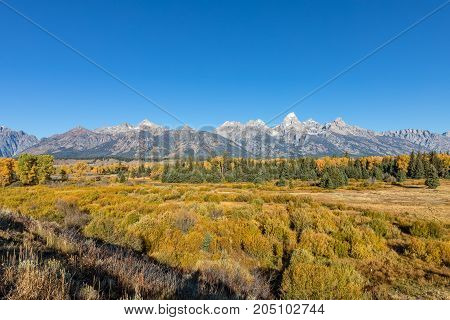 a scenic fall landscape of the Teton Range in Wyoming