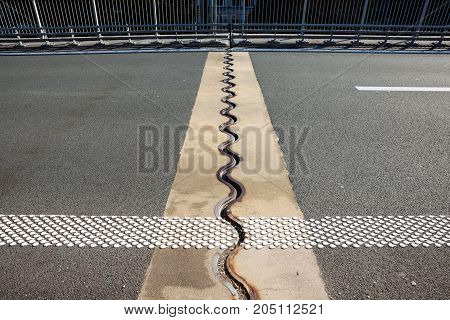 asphalt separation in the highway bridge roadway