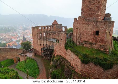 Ancient castle Wertheim. Top view from above of the ruined fortress walls and the old city in the fog. Germany. Tourist attraction