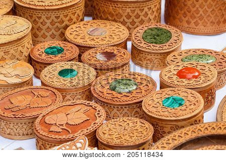 Handicrafts made of birch bark. Various carved boxes on the traditional town fair.