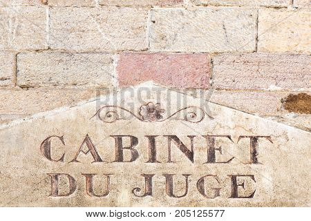 Judge's office in French on awall, France