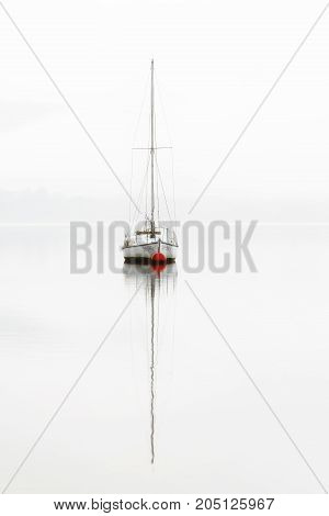 Single boat in a misty day in Vitoria