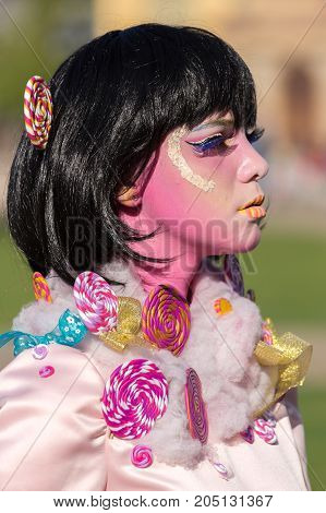 TIMISOARA ROMANIA - APRIL 1 2017: Detail of one living statue of a woman multicolor dressed and present on the street inside the CheckART Carnival organized by the City Hall Timisoara. Union Square.