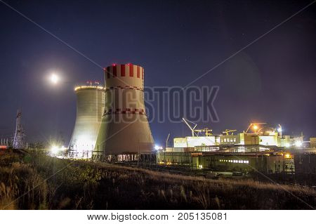 Night view of construction site of new building nuclear power plant