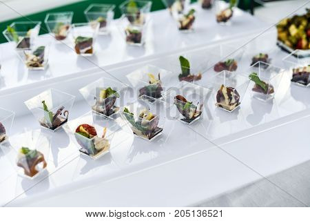 buffet table, Canape, sandwiches, snacks, holiday table, sliced, glasses celebration new year christmas fourchette catering table setting