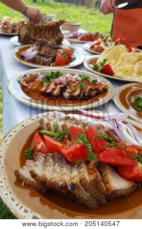 Traditional Romanian pork dish on a outdoor buffet