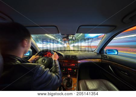 Driver In Car Moves At Fast Speed At Night.