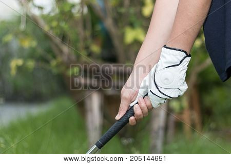 Golfer Wearing White Glove Holdiing Golf Club