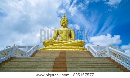 The big golden Buddha statue in Ayutthaya, Thailand. sky background.