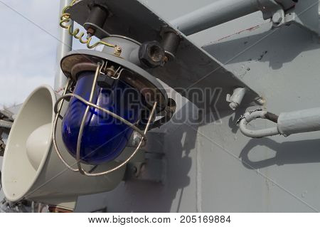 Military blue and white laterns and horn on the ship
