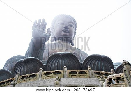 The enormous Tian Tan Buddha statue at high mountain near Po Lin Monastery, Lantau Island, Hong Kong.