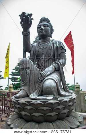HONG KONG - MAY 31: Buddhist statue praising Tian Tan Buddha at Ngong Ping, Lantau Island, in Hong Kong