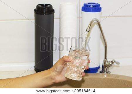 Great filters to purify your drinking water an image isolated in the kitchen interior.