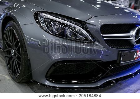 Sankt-Petersburg Russia July 21 2017: Front view of a Mercedes Benz C 63s AMG coupe 2017. Front Headlight. Dark Matt colour .Car exterior details. Photo Taken at Royal Auto Show July 21