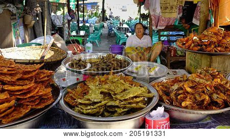 A Vendor Selling Foods On Street